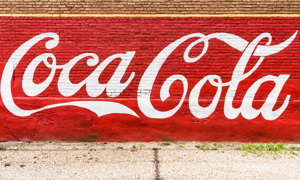 An old, painted Coca-Cola sign