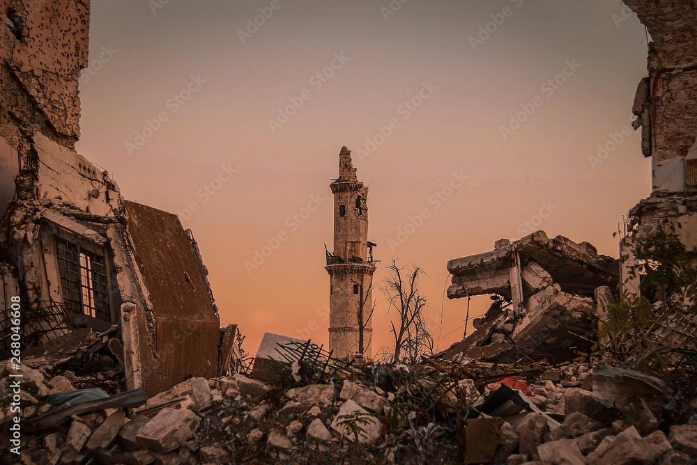 Destroyed buildings next to a mosque in the city of Aleppo in Syria