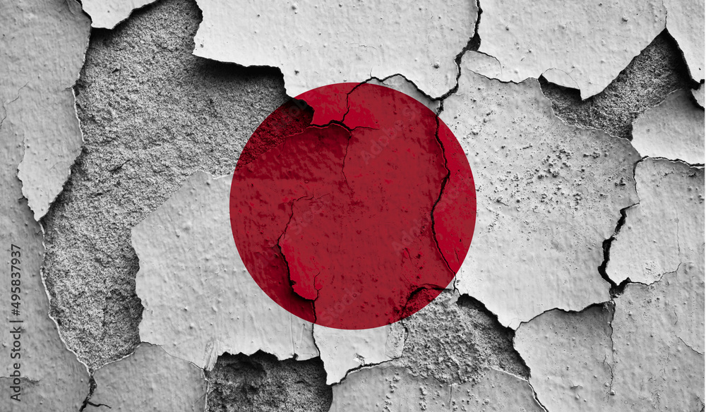 Flag of Japan on old grunge wall in background
