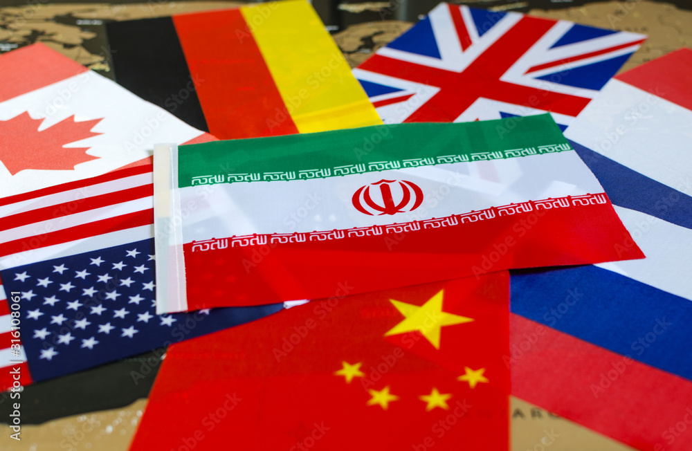national flag of Iran on the background of the flags of the United States, Canada, Germany, France, great Britain, China, Russia