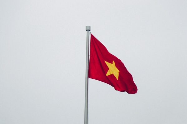 red and yellow flag close up photography