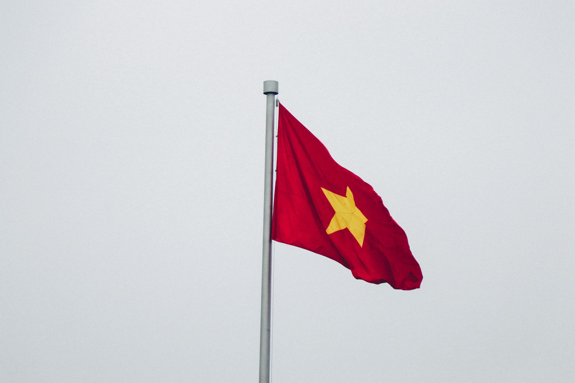 red and yellow flag close up photography
