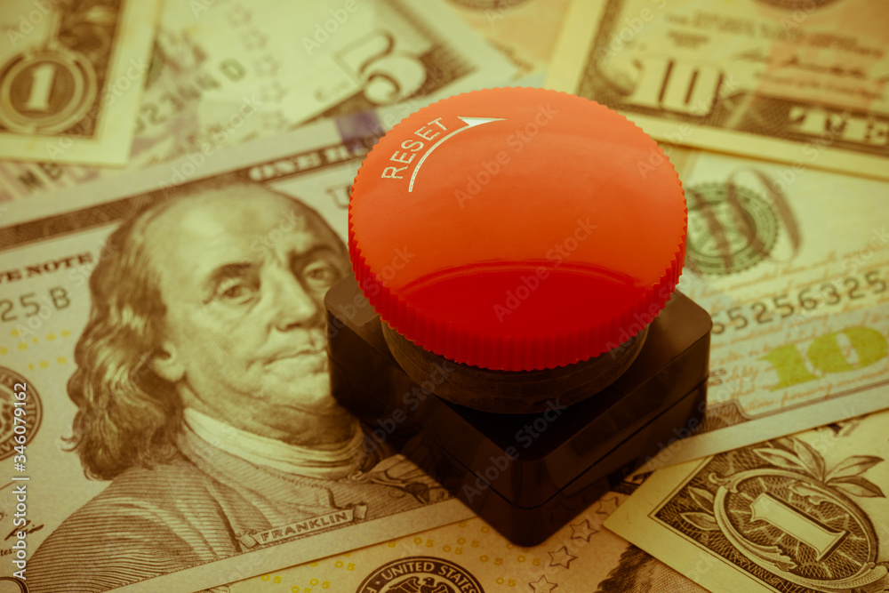 Red emergency stop push button switch on US dollar banknotes bill background with copy space. Concept of stop, fix, repair, United states of america or global world economy financial crisis solution..