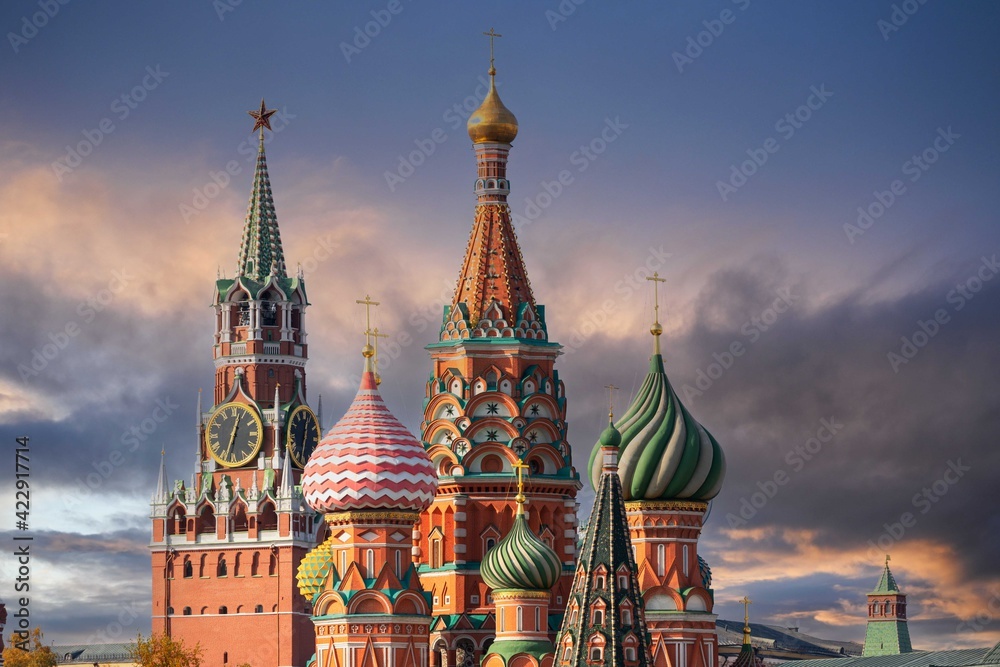St. Basil’s Cathedral and Spassky Tower on Red Square in Moscow. Orthodox church and architectural masterpieces of Moscow. Most famous sights of Russia. Life before pandemic COVID-19
