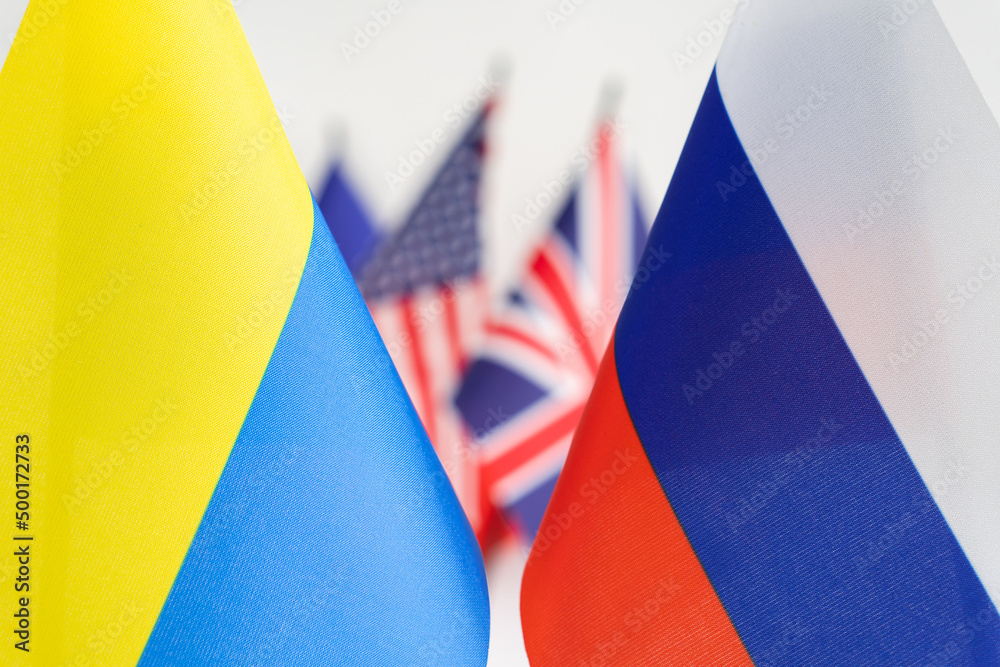 State flag of Russia and Ukraine. UK and USA flags on background. Russian Ukrainian war conflict